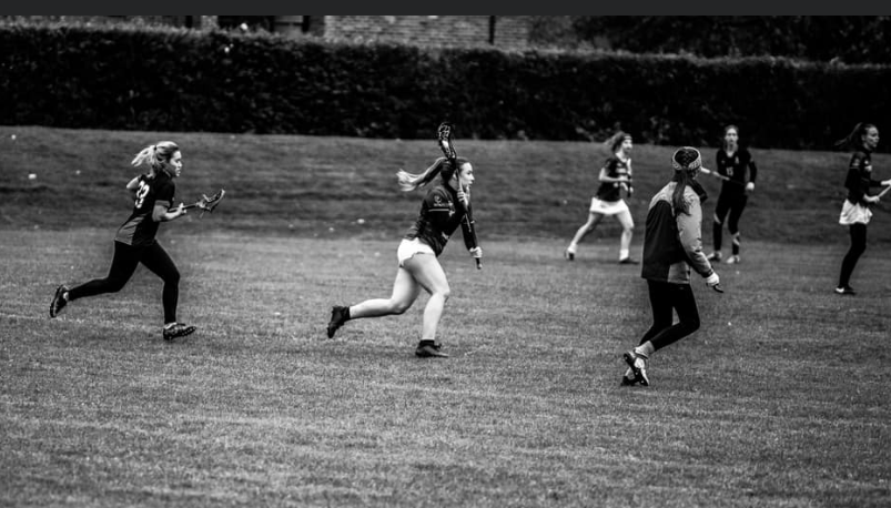 Charlotte Lewis playing lacrosse