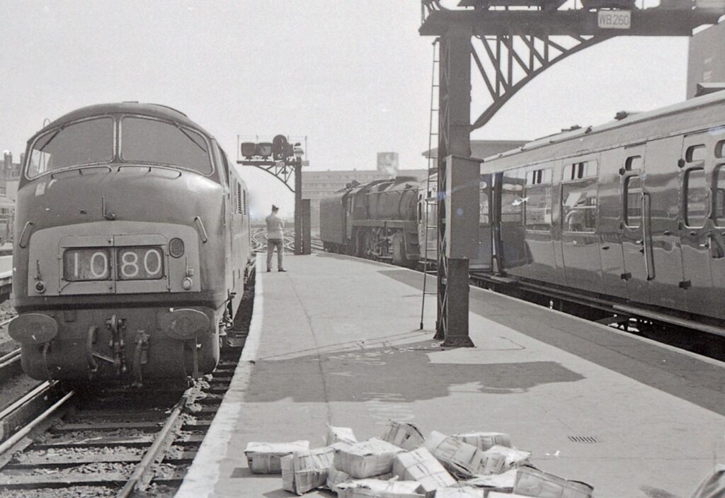 Above: An unidentified BR Class 42, only 6 years old in this picture, sits in a platform on the left at  Waterloo in 1967, with a Standard 5MT sat in the platform on the right behind the coach. 